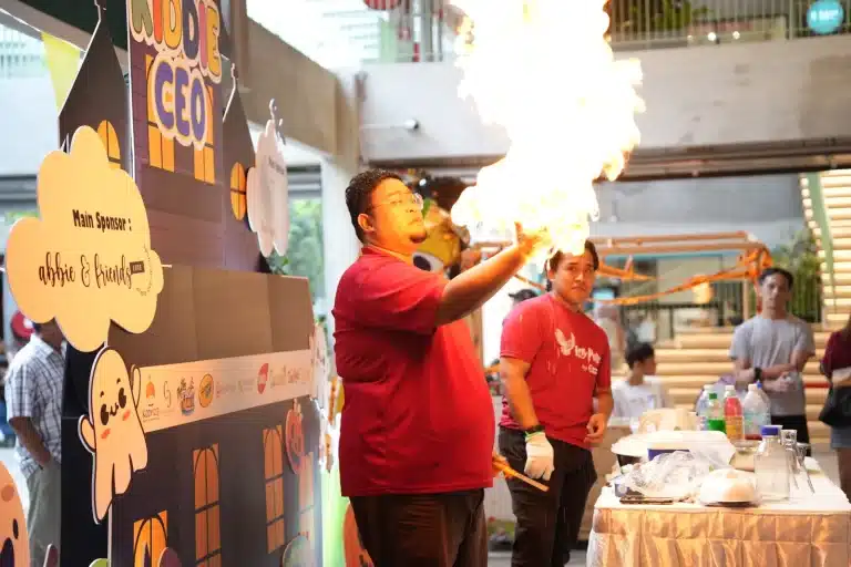 A fire science show in front of the Kiddie CEO backdrop